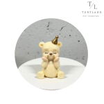 Шоколадна фігурка "Ведмедик в ковпачку білий"